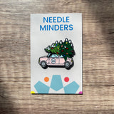 Festive magnetic needle minder