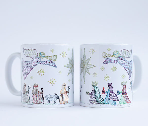 two mugs side by side to show both views of a nativity scene featuring angels, wise men, shepherds and sheep in  a kantha stitched embroiderystyle