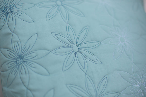 duck egg blue cushion detail with free motion machine quilting
